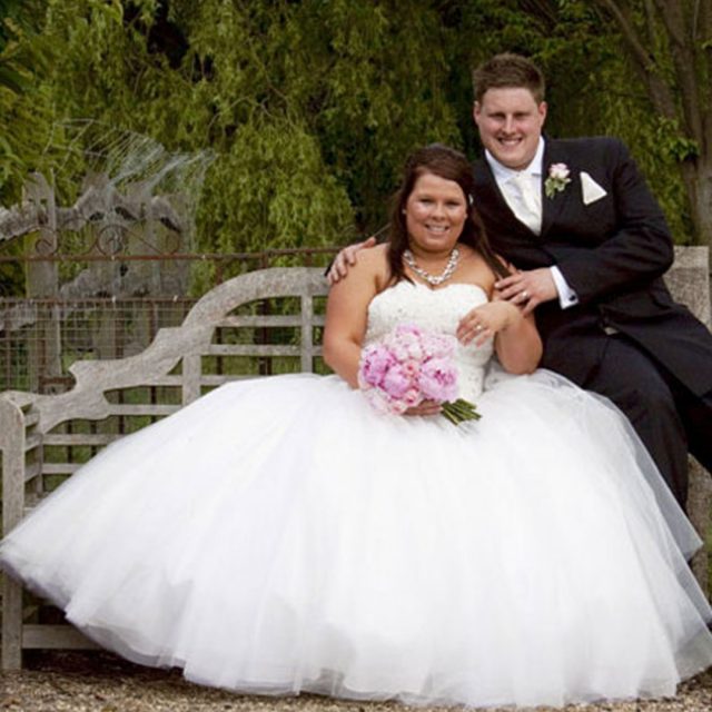 Bride and groom in the gardens of Gaynes Park – wedding venues in Essex