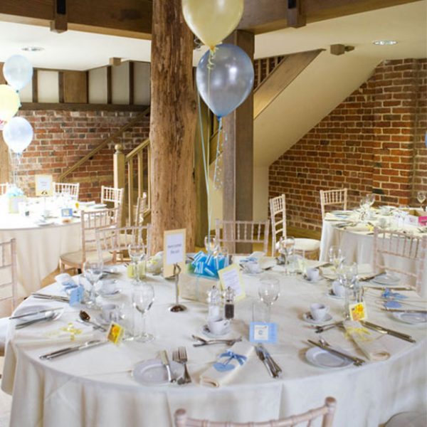 Cream yellow and blue table decorations for a reception – wedding barns Essex