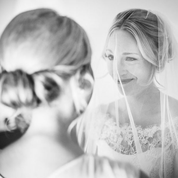 Bride and bridesmaid before the wedding ceremony at Gaynes Park in Essex