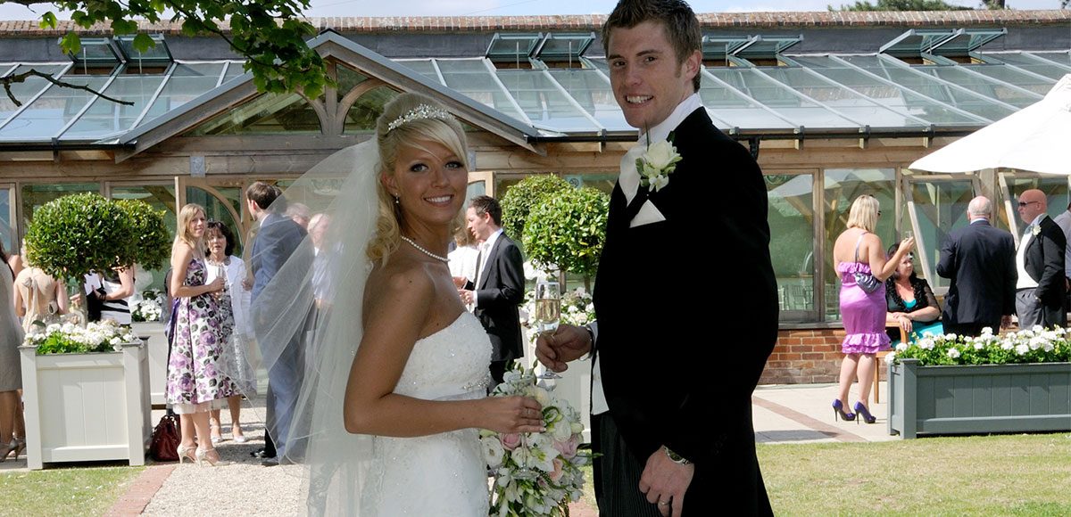 Bride and groom by the Orangery – wedding venues in Essex