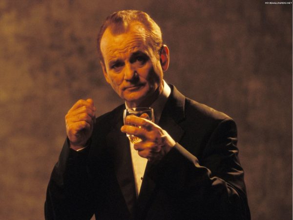 Possibly the most dapper man in the world, Bill Murray, wearing a tailored Italian tuxedo, clicks his fingers in time to light jazz while drinking an expensive single malt.