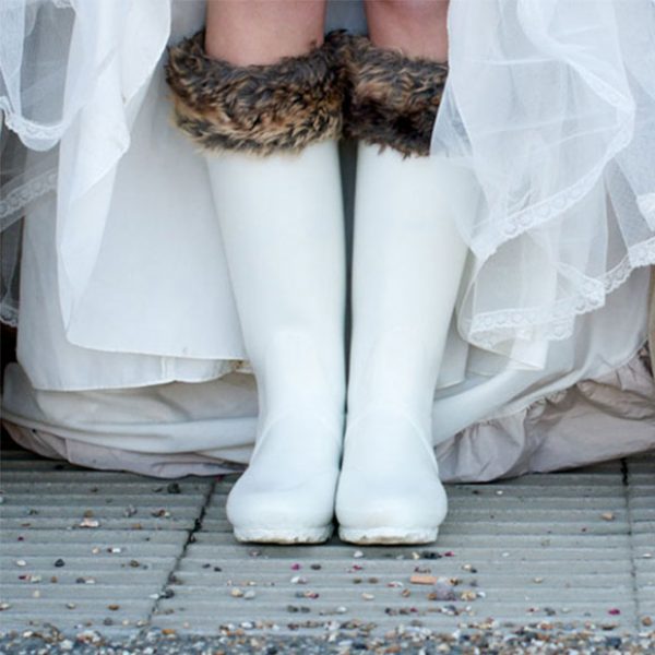 The bride wore white wedding wellies