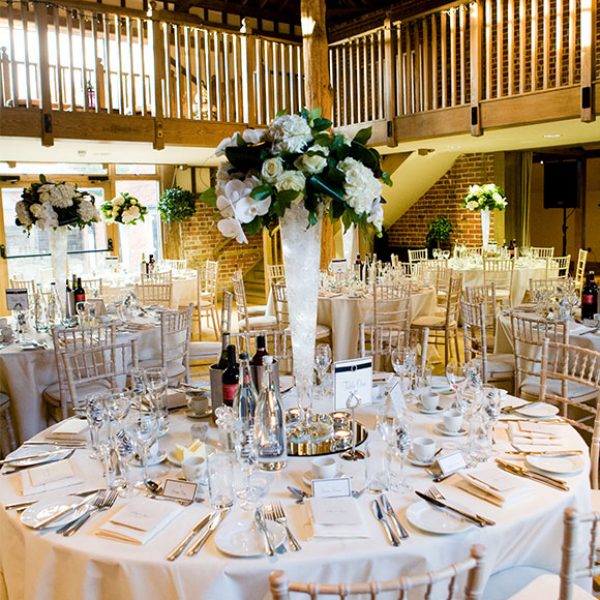 White flowers in a tall vase for wedding decoration – wedding venues in Essex