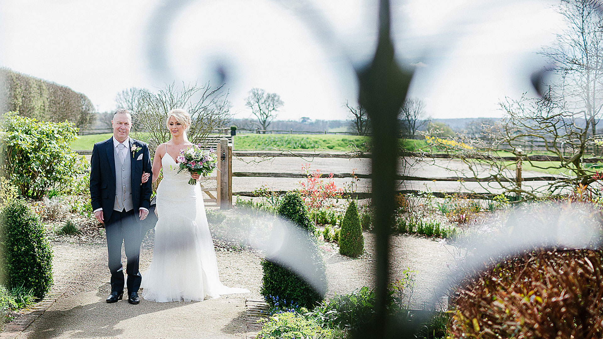 A bride and her father begin their walk down the wedding aisle - wedding ceremony venues in Essex