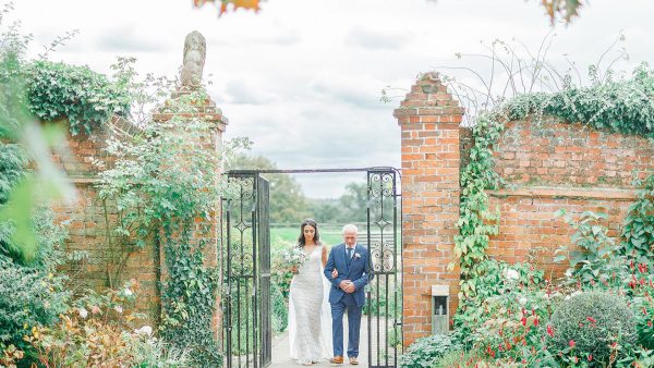 A bride and her father make their way down the Long Walk wedding aisle - wedding venues in Essex