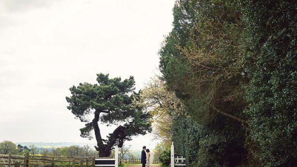 A happy couple share a moment alone at this beautiful countryside wedding venue - wedding barns Essex