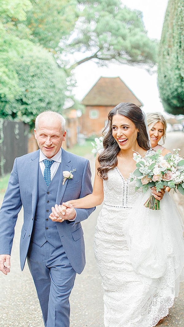 A bride and her father are about to experience a special moment - walking down the wedding aisle