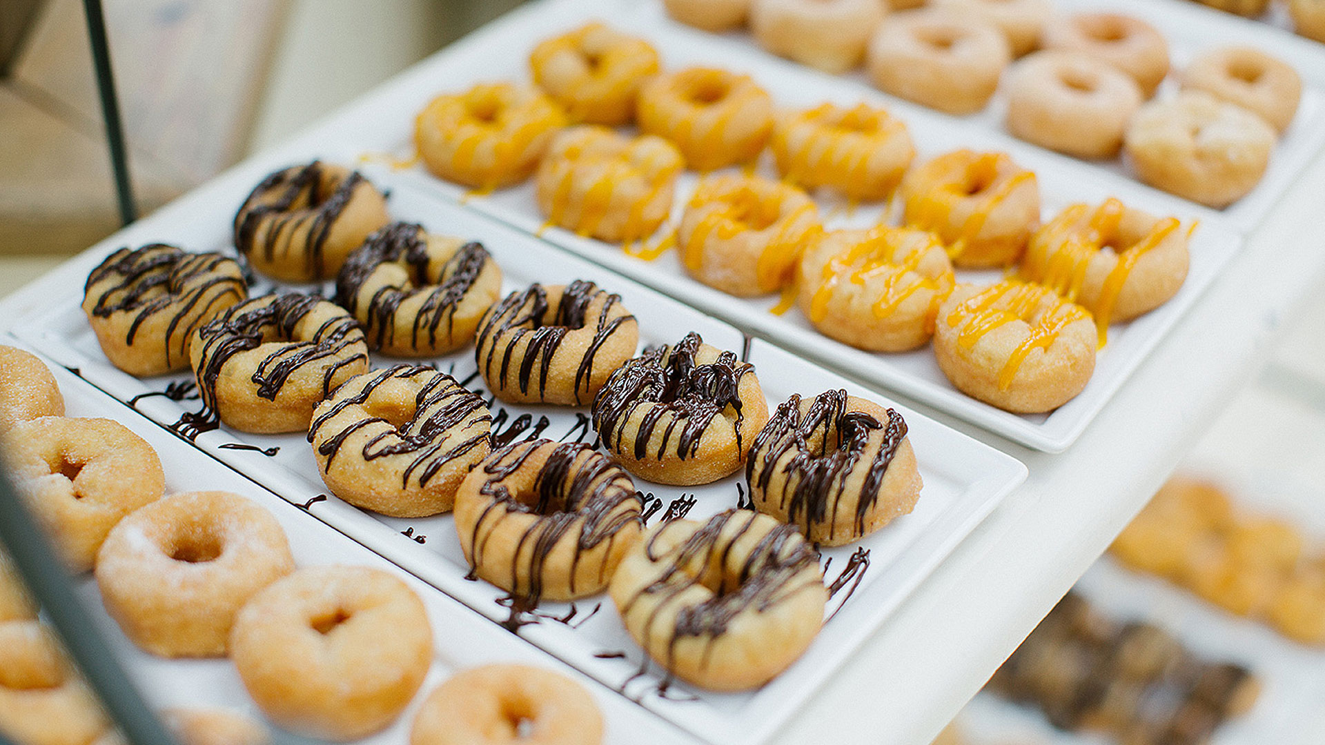 Guests will love these flavoured doughnuts at the sweet table - wedding reception ideas