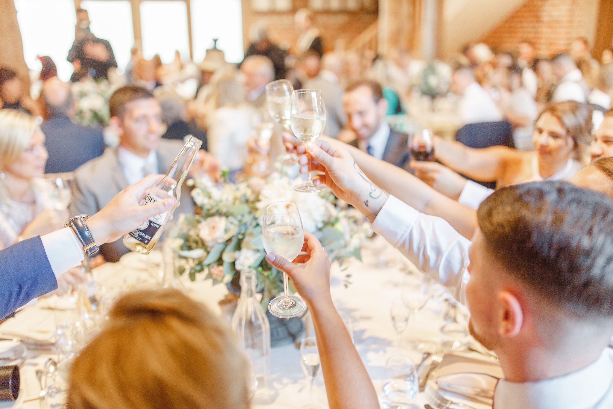 guests raise a toast wedding speeches