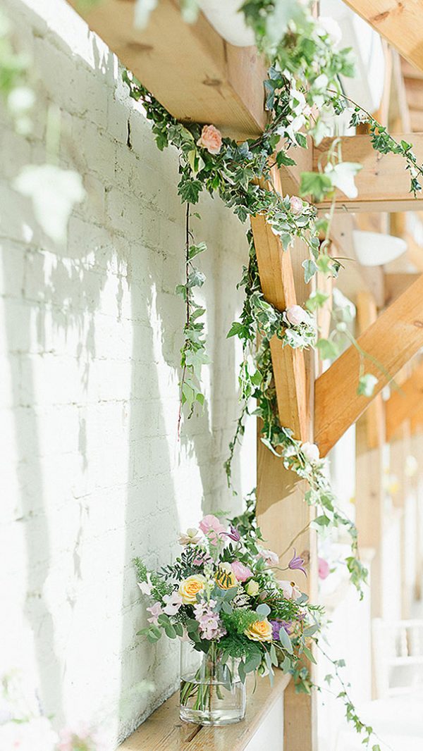 The beautiful oak beams are wrapped in Ivy for this gorgeous summer wedding - barn weddings Essex