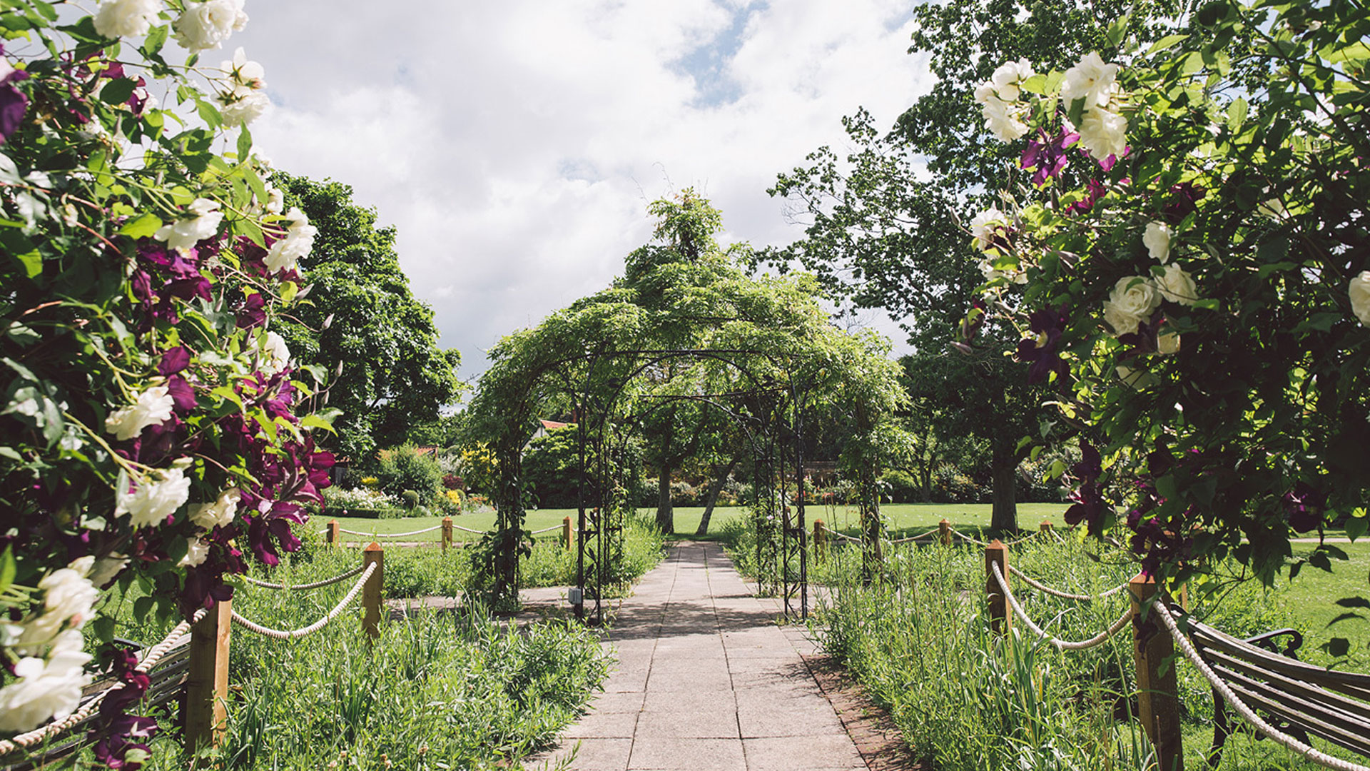 The Walled Garden is full of blooms and home to many seating areas - wedding venues in Essex
