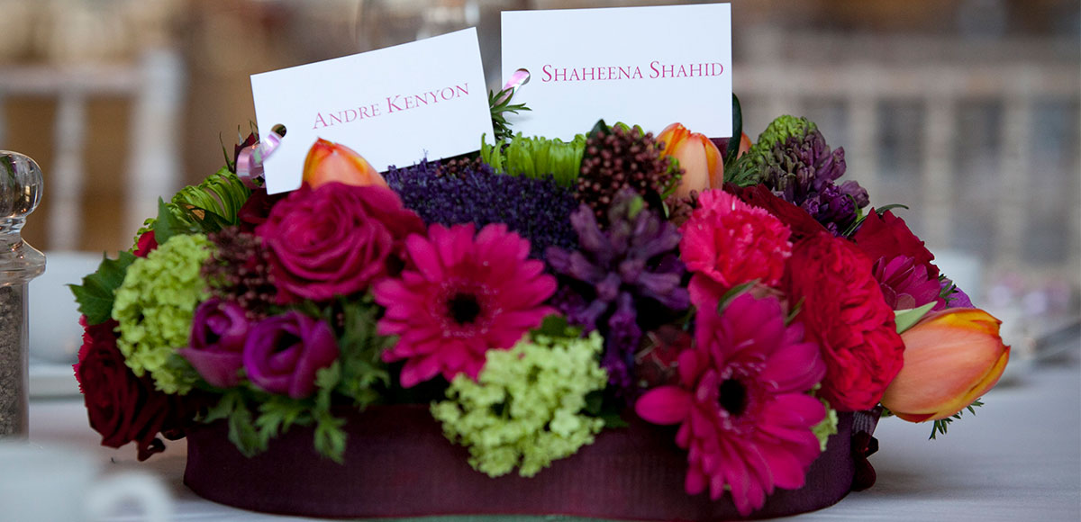 Pink and purple flower wedding table decorations for a barn wedding in