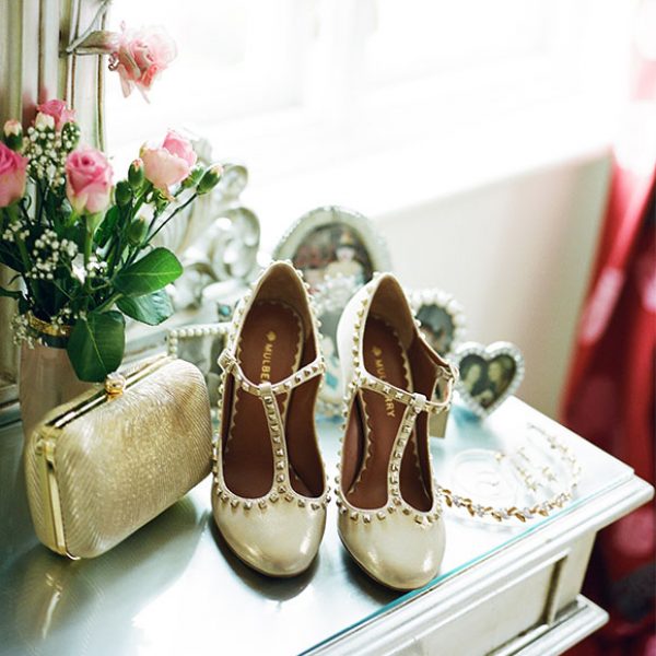Gold wedding shoes ready for a Gaynes Park wedding ceremony