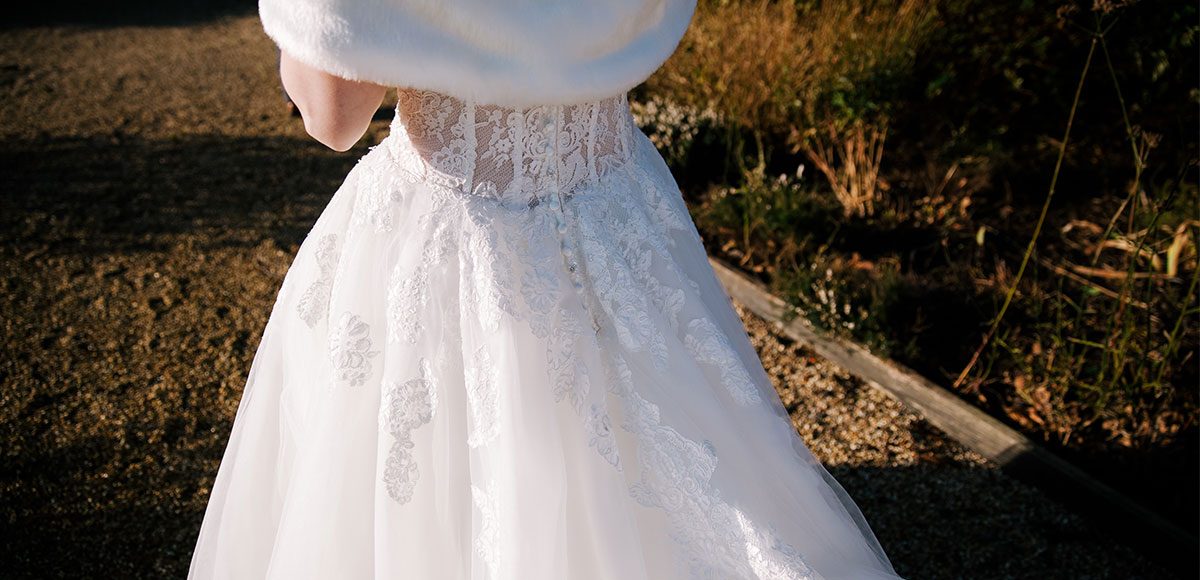Winter wedding dress and white fur shawl for a Gaynes Park wedding – wedding barns Essex