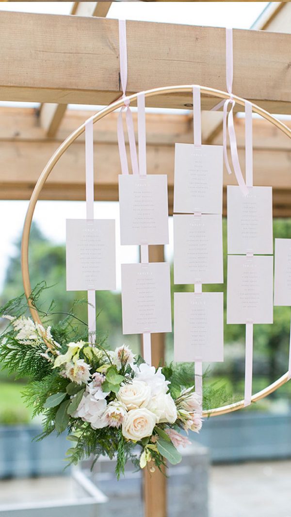 A gorgeous wooden hoop floral wedding table plan is the perfect addition to your wedding decorations