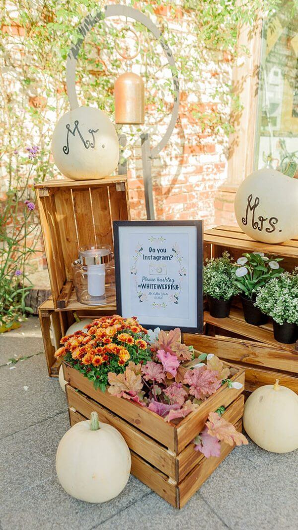 Wooden boxes and white pumpkins are perfect for a rustic autumn themed wedding at Gaynes Park