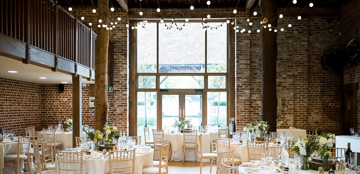 The Mill Barn at Gaynes Park set up for a wedding breakfast