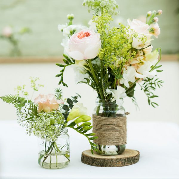 Rustic Mason jars used for wedding flowers and decorations