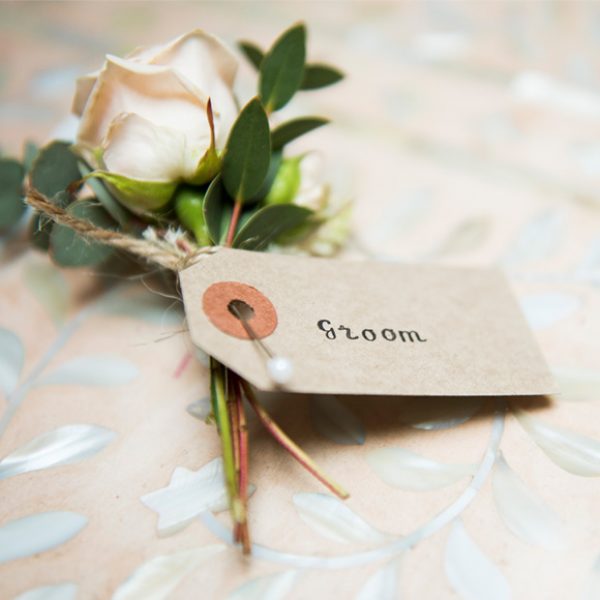 A rose buttonhole for the groom