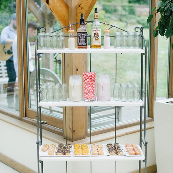 Guests are treated to flavoured doughnuts and milk at this fun spring wedding