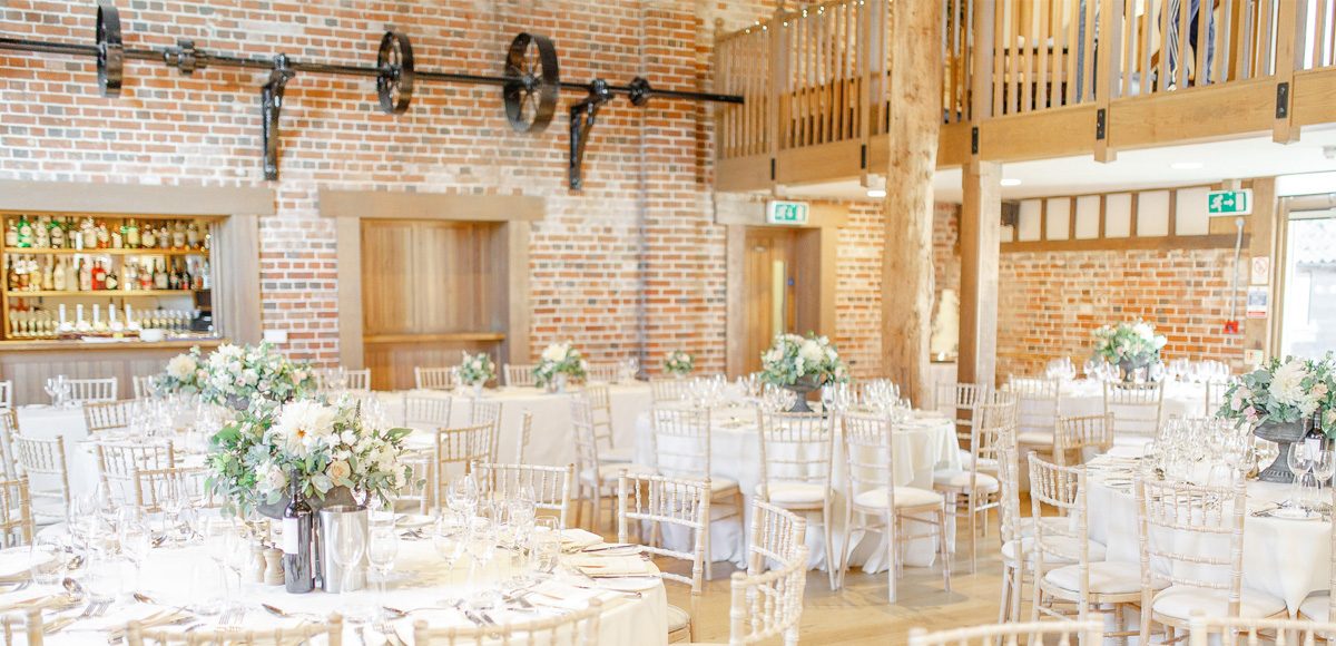 Set up for a beautiful wedding breakfast the Mill Barn at Gaynes Park creates a beautiful setting for a rustic country wedding