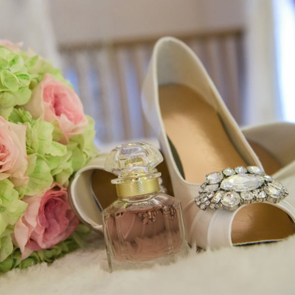 The bride wore classic wedding shoes along with her favourite perfume for her wedding at Gaynes Park in Essex