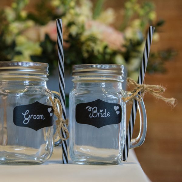 Bride and groom jam jar drinks glasses were perfect for cocktails after the wedding ceremony – wedding ideas
