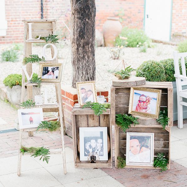 Pictures of the couple were displayed in apple crates for a rustic wedding look