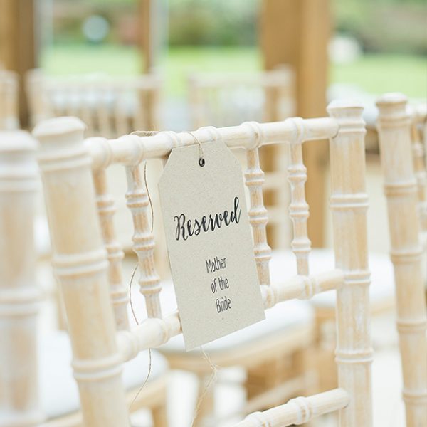 A tag attached to a chair in the Orangery at Gaynes Park creates a beautiful reserved seating sign