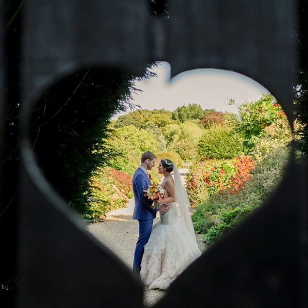 The heart gate at Gaynes Park is a beautiful frame for newlyweds to capture a stunning wedding photo