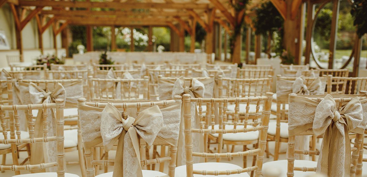Hessian and lace chair sashes adorned the chairs for this summer wedding at Gaynes Park in Essex