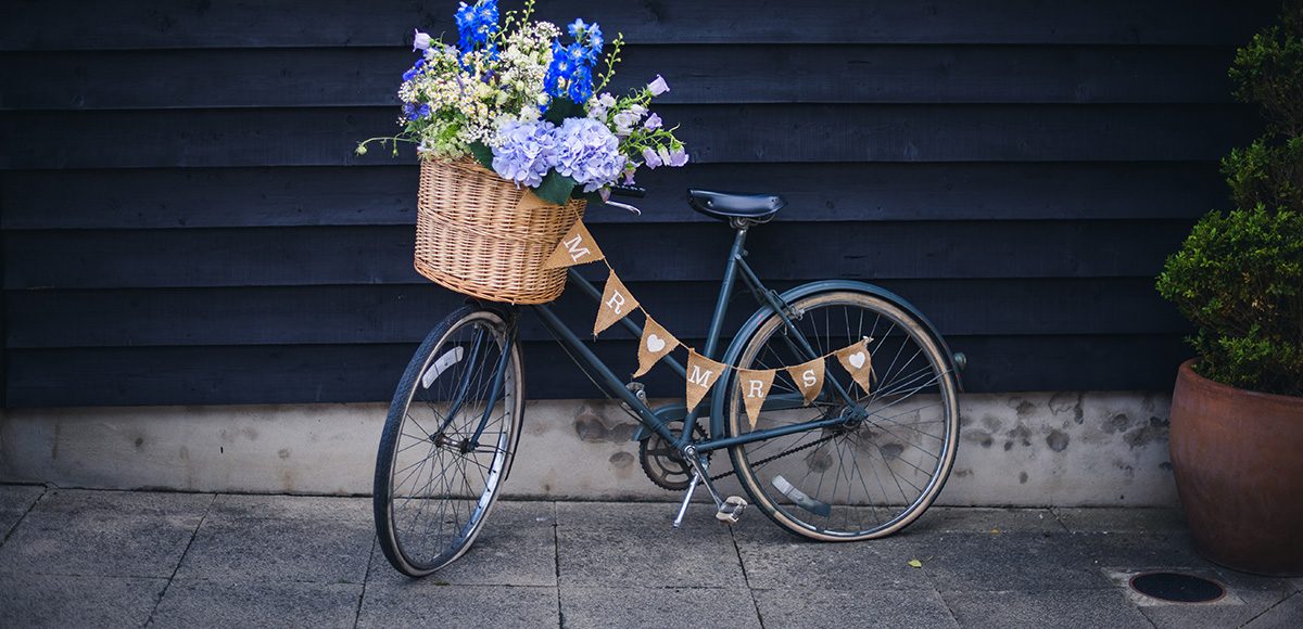 For their wedding at Gaynes Park a couple chose a vintage bike as a rustic wedding prop