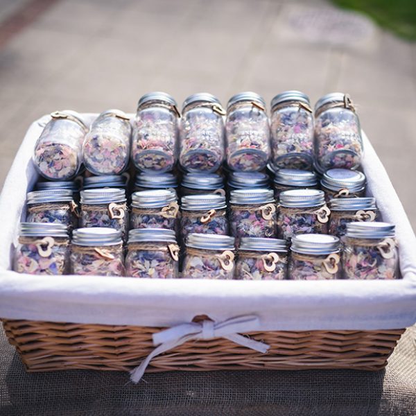 Jars of wedding confetti are perfect for a rustic wedding at Gaynes Park