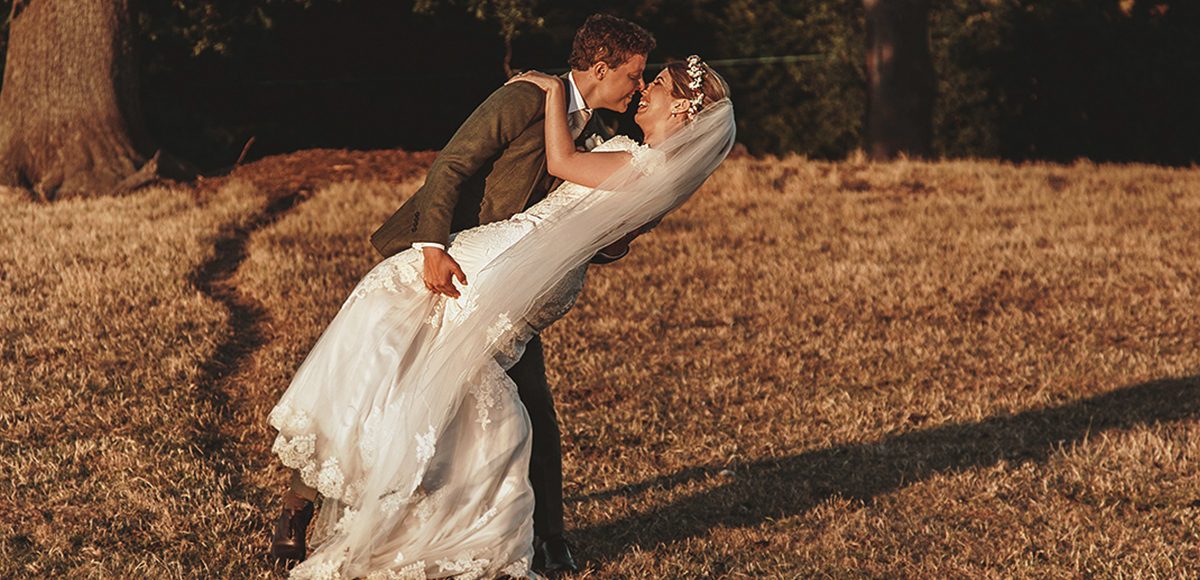 The newlyweds make the most of the grounds at Gaynes Park as the sunsets