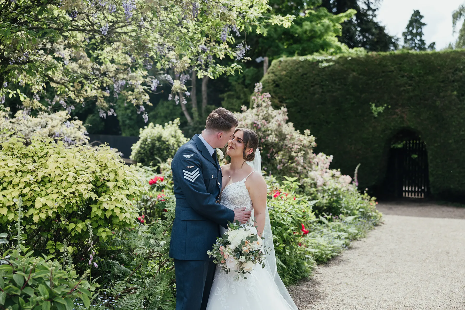 Couple on the long walk gardens at Gaynes Park wedding venue